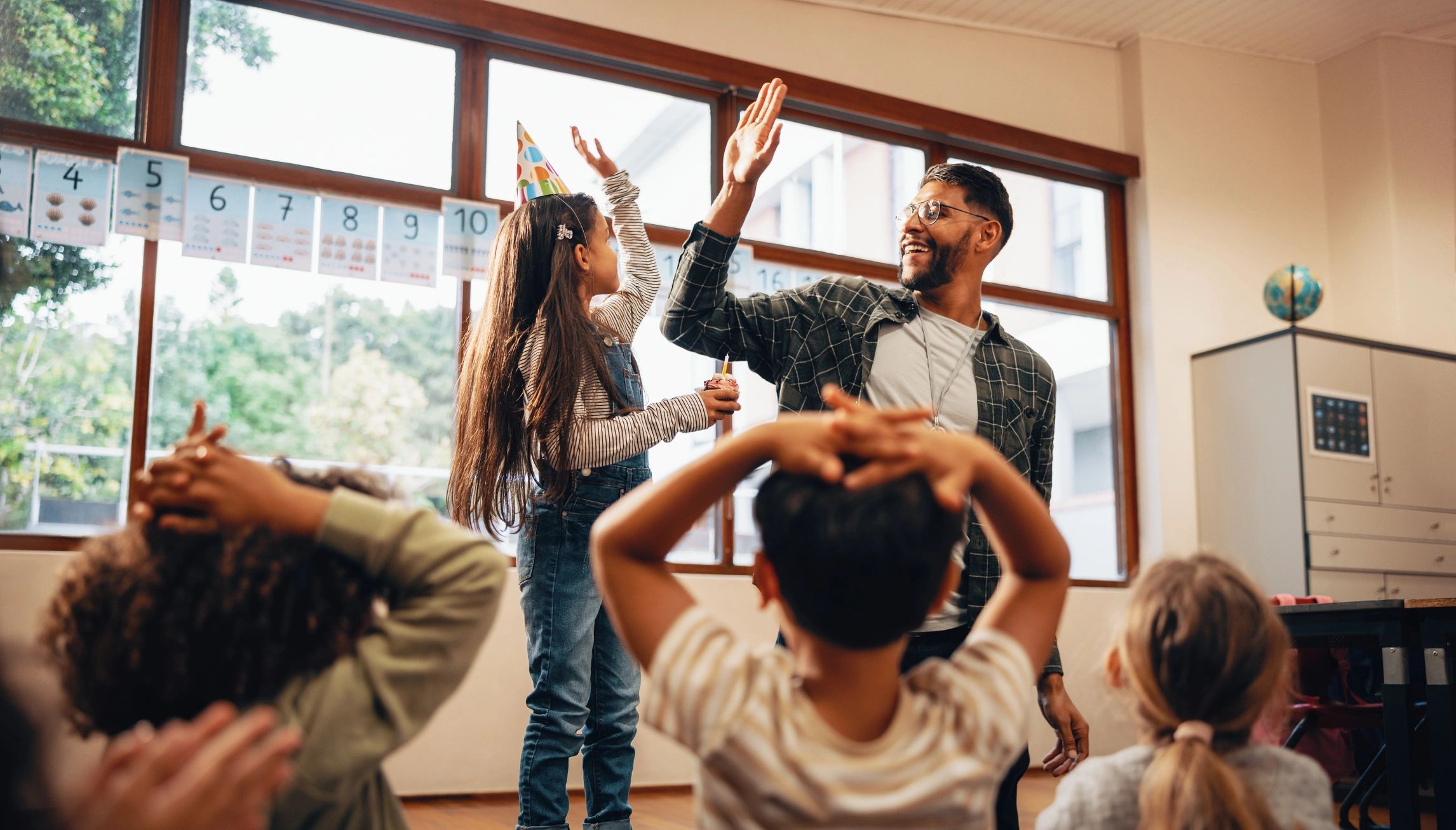 Parent and child celebration moment in classroom