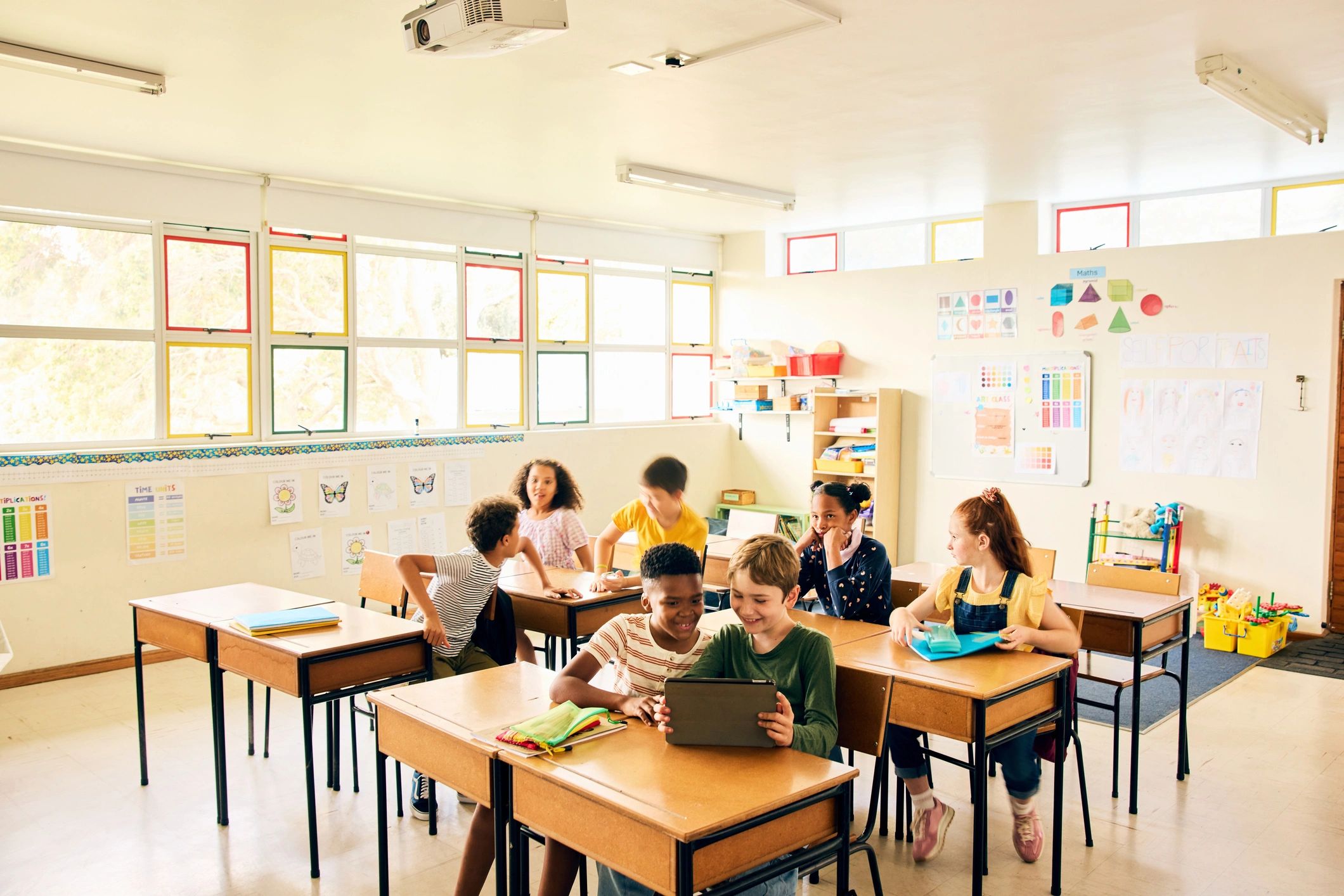 Children learning together in a colorful classroom